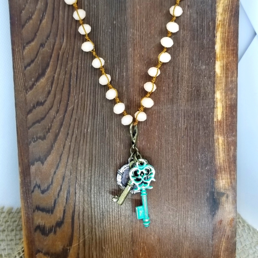 Beaded necklace with charms